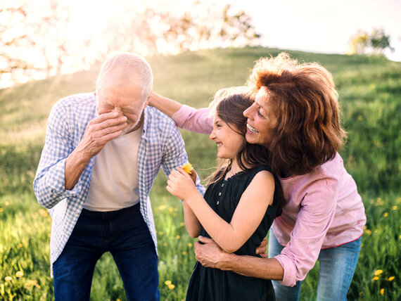 Happy family enjoying the park during pollen season