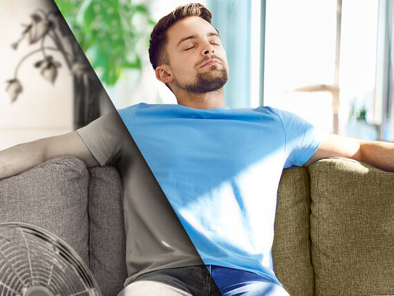Young man relaxing on couch enjoying fresh air of comfortable indoor climate